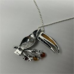 Silver Baltic amber toucan pendant necklace