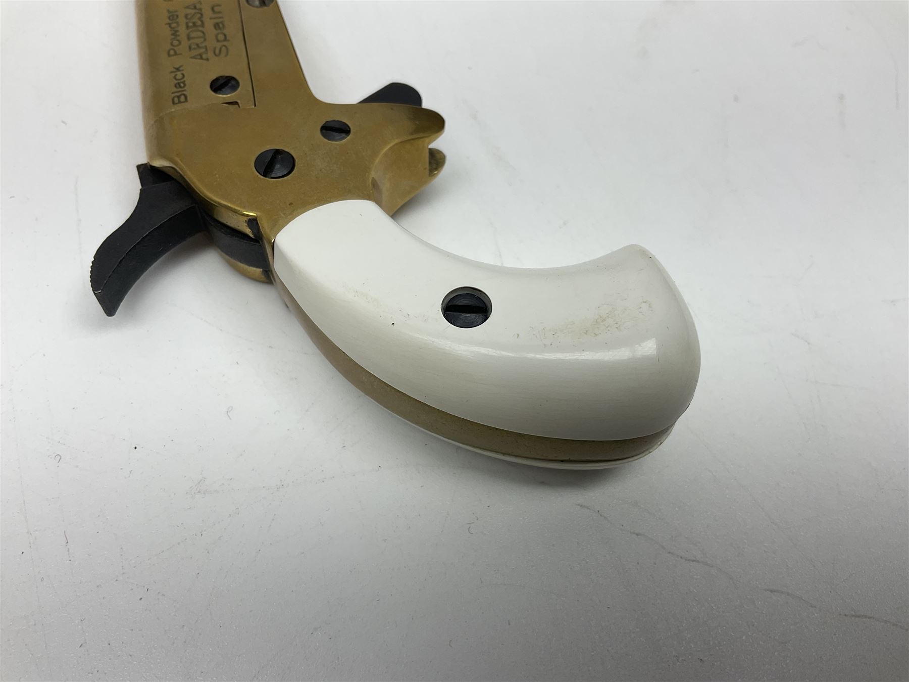 SECTION 1 FIRE-ARMS CERTIFICATE REQUIRED - Spanish Ardesa percussion vest pocket Derringer pistol, .31 cal. black powder; single shot; 6cm barrel; all brass body with white grips; no.14-13-013682-10 with Spanish certificate dated 2010 and box of one hundred balls