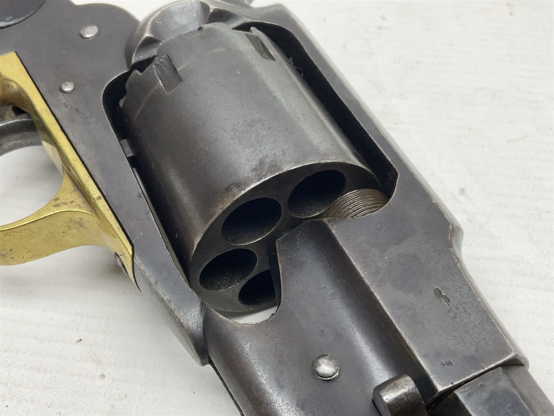 Unmarked Spencer & Rogers type Remington style .44 cal. six-shot percussion revolver, 20cm octagonal barrel with loading lever under, brass trigger guard and two-piece wooden grip L37cm overall; together with a framed watercolour by Alan J. Gray dated 2009 entitled 'The Remington .44 Calibre 1861 Navy Revolver'  19 x 42cm (2)