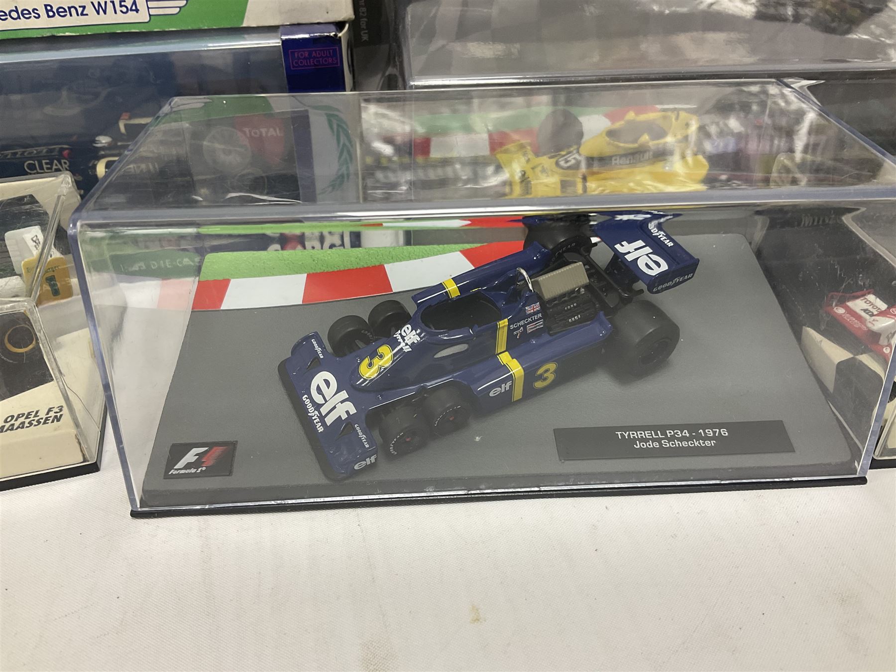 Panini Formula 1 The Car Collection - twelve die-cast models including ten in unopened packaging with periodical; all models in plastic display boxes; and eight other boxed die-cast models of racing cars by Corgi, Onyx, Classico, Minichamps etc (20)