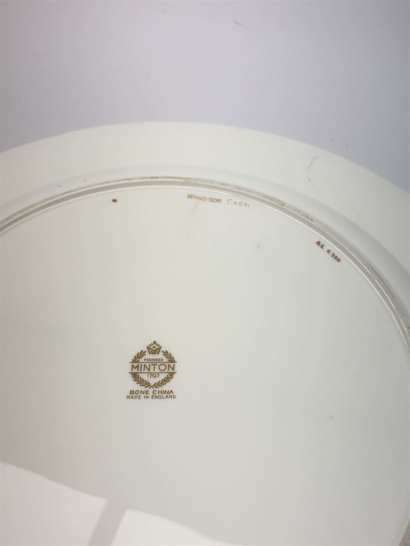 Large Minton cabinet plate, with central hand painted panel of Windsor Castle, signed A Holland, within a tooled gilt turquoise border, with impressed and printed marks and inscribed Windsor Castle beneath, D32cm