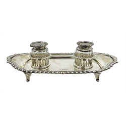  Silver inkstand of shaped rectangular form, gadroon border,  two detachable faceted glass inkwells with silver mounted lids by William Hutton & Sons Ltd, Sheffield 1923 L23cm  