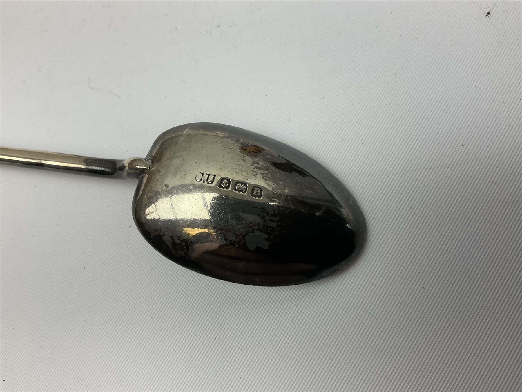 German silver pill box of oval form, the cover decorated with a serpent, stamped with crown and crescent and marked 800, together with a miniature silver capstan inkwell with glass liner, hallmarked Birmingham, a novelty silver teaspoon with golf club terminal, hallmarked Birmingham, and an amber glass scent bottle with silver plated cover, approximate weighable silver (not including inkwell or scent bottle with silver plated cover) 41.9 grams