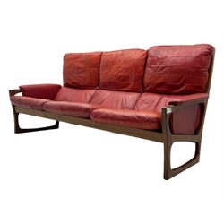 Folke Ohlsson for Gimson & Slater - mid-20th century Danish teak-framed sofa, red leather upholstery with patchwork design, raised on shaped teak side supports