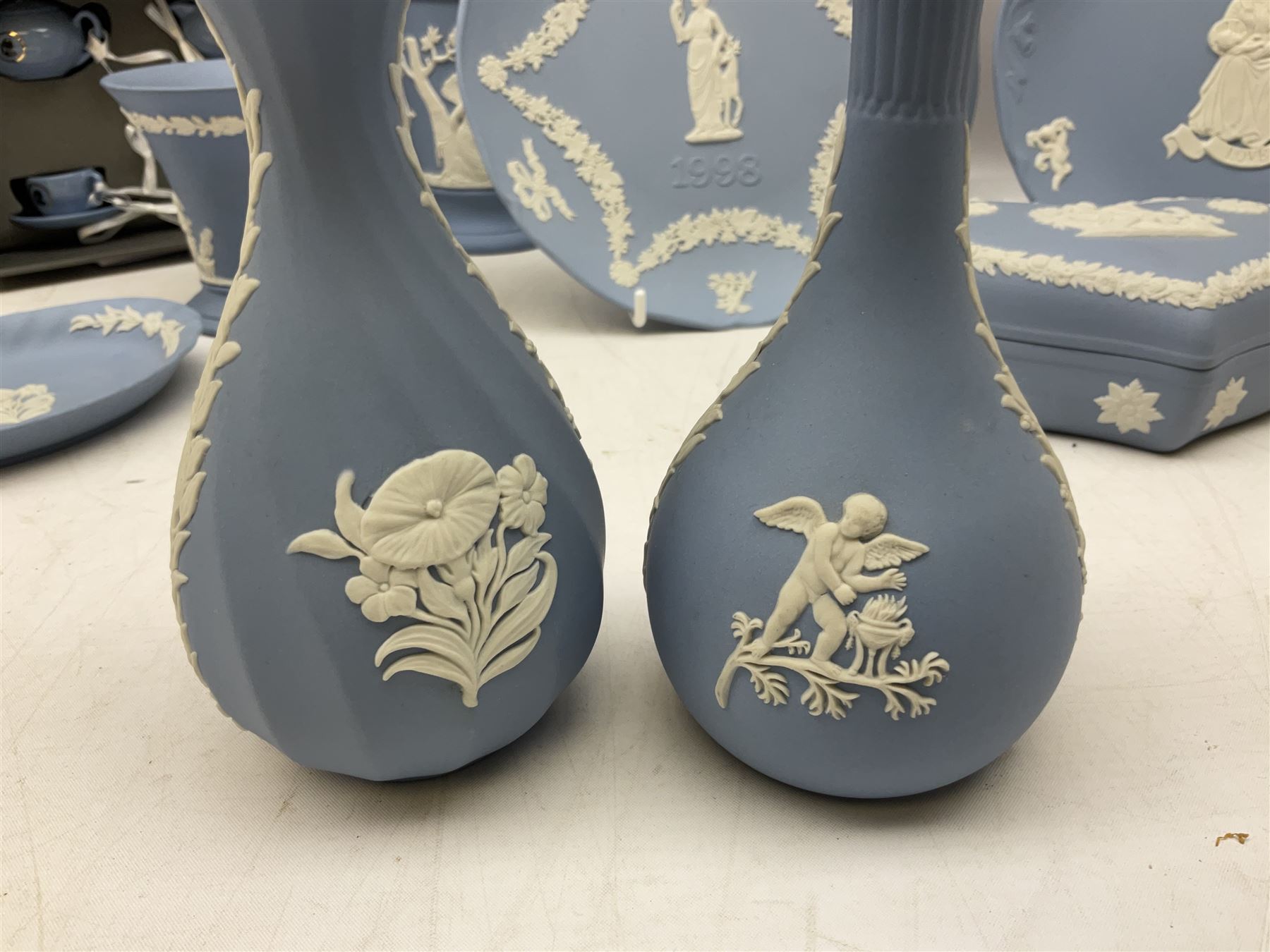 Wedgwood pale blue Jasperware, to include a pair of tulip vases, large vase with fluted rim, trinket dishes, trinket box etc, together with Wedgwood miniature hanging decoration in the form of a tea set 