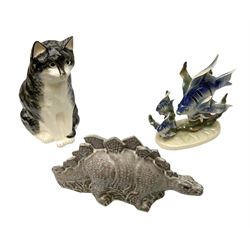 Babbacombe pottery study of a seated cat designed by Philip Lawreston, Jema of Holland angel fish figurine and a ceramic Stegosaurus 