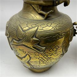 Pair of Chinese brass vases, of ovoid form with elongated neck and fluted rim, decorated in high relief with a dragon chasing a flaming pearl around the neck, the body with dragons, birds and buildings, with character marks beneath, H25cm