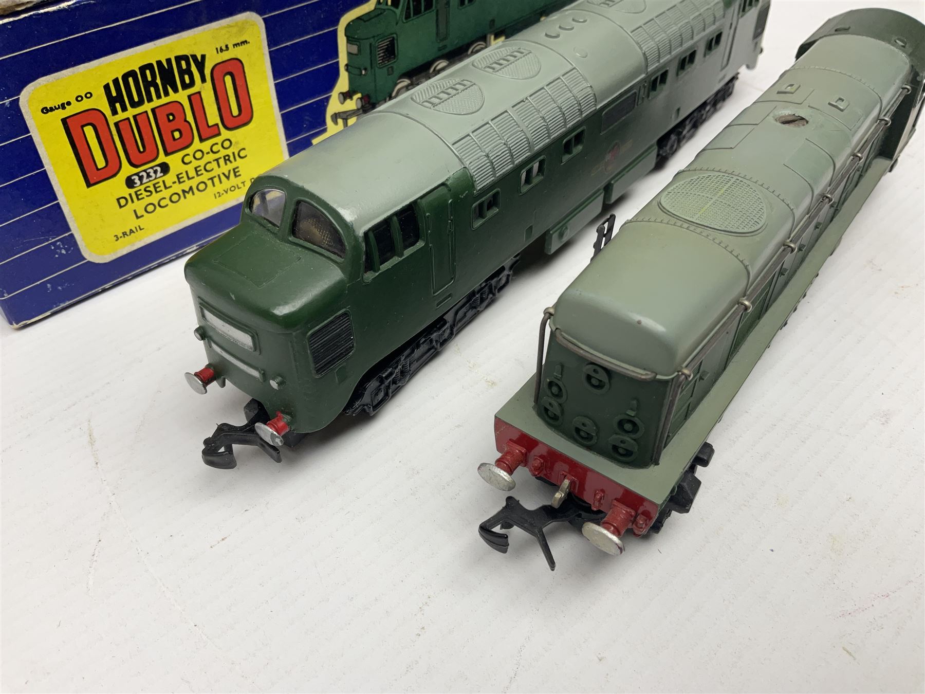 Hornby Dublo - three-rail - Deltic Type Diesel Co-Co locomotive with instructions and guarantee; and Class 20 1000 B.H.P. Bo-Bo Diesel Electric locomotive No.D8000; both in BR green; and each in original blue striped box (2)

