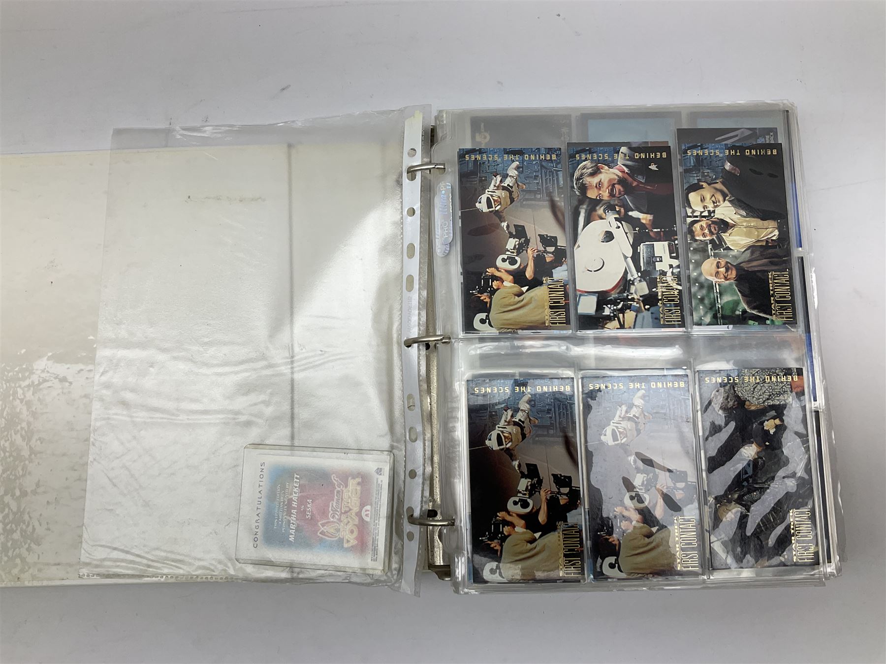 Collection of Star Trek collectors cards to include ‘Alternate Universe’ and ‘Q Continuum’ series, Star Wars cards etc housed in white album
and Harry Potter, Disney and other loose examples