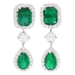 Pair of 18ct white gold emerald and diamond pendant stud earrings, the two clusters separated by a single round brilliant cut diamond, stamped, total emerald weight approx 5.80 carat, total diamond weight approx 2.45 carat