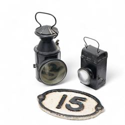 LNER Welch patent international signals lamp No711206, LMS lamp with bullseye lens, B.R.(M) lamp, another railway lamp, oval plate'15' and an LNER tin
