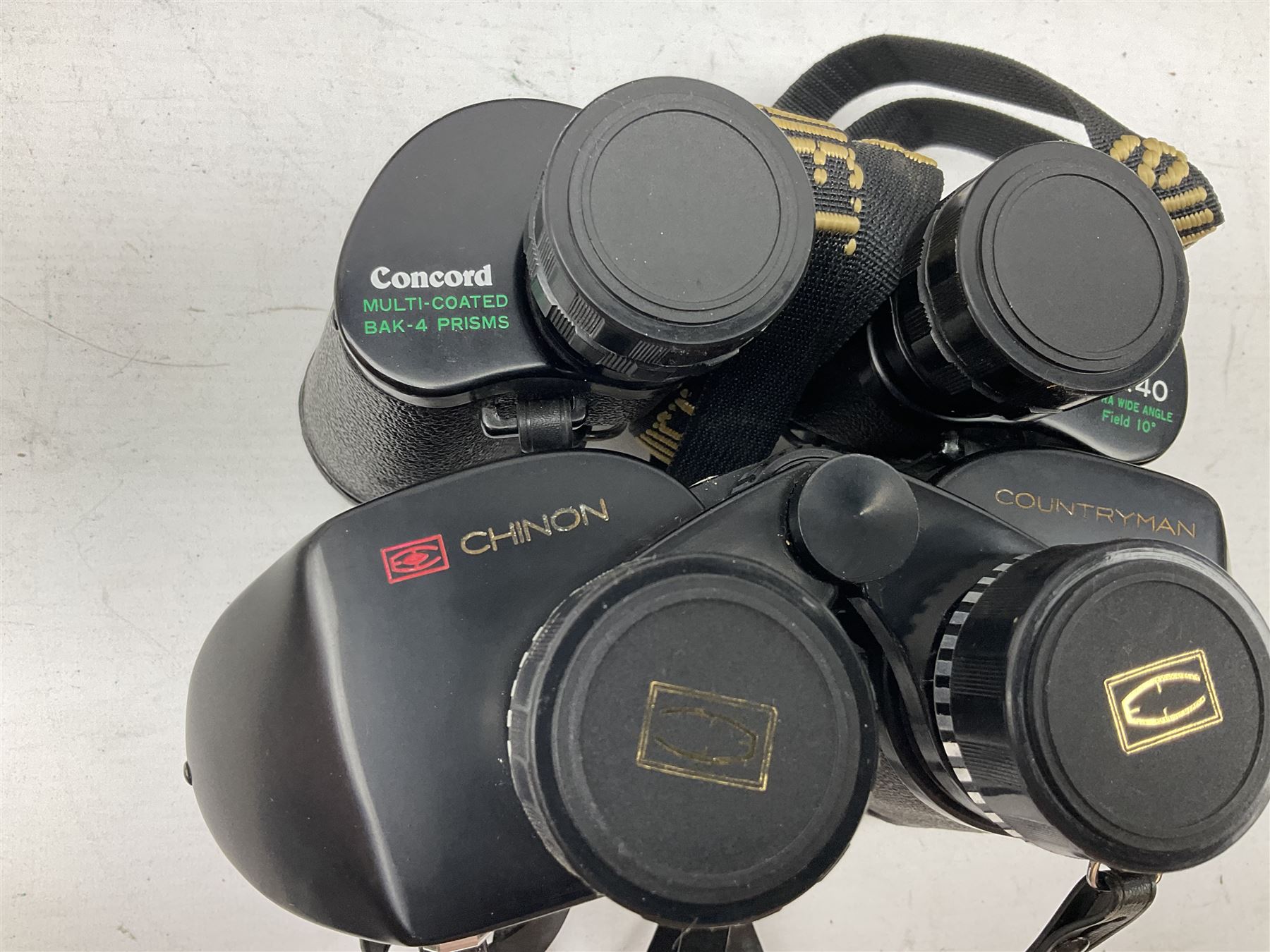 Eleven cased pairs of binoculars to include Summit 8x30,  Concord 8x40, Tasco no. 106 8x - 16x40, Chinon 10x50, Tokina 7x42 Field, Zoom 6x- 12x32 etc