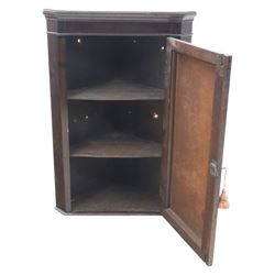 George III country oak corner cupboard, enclosed by single cushion panelled door, brass H hinges
