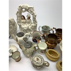 A group of 19th century ceramics, comprising agateware teapot with pewter cover, the body detailed with verse, a further example detailed A Present from Blackpool, large Wedgwood best composition mortar, two copper lustre jugs and a small cup, floral print decorated jug possibly Don Pottery, Gaudy Welsh jug, floral painted mug, Staffordshire nursery plate, teapot, and teacup and saucer, reticulated chestnut basket, Staffordshire bough group, plus a later Staffordshire style dog. (9). 