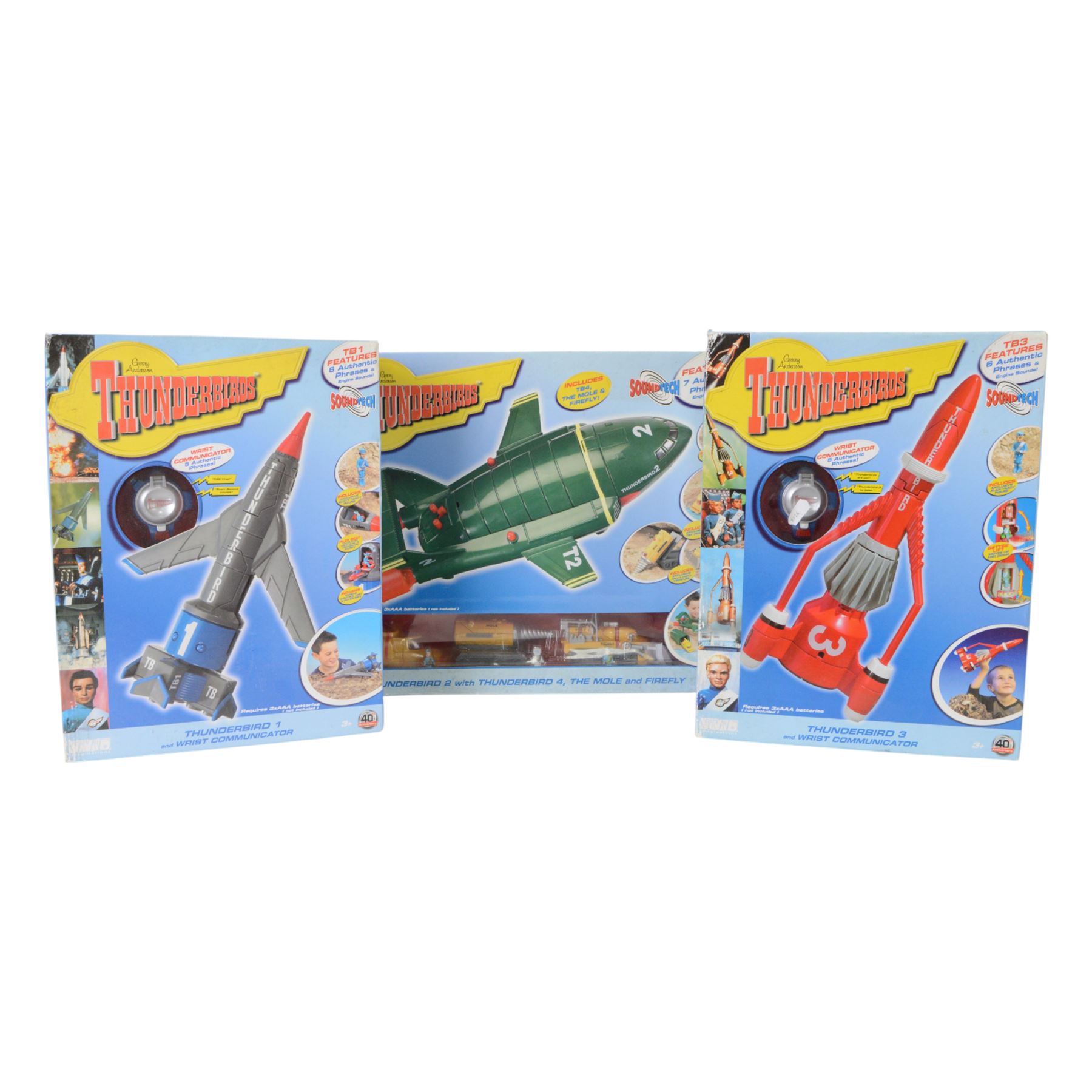 Three Vivid Imaginations Thunderbirds vehicles, comprising Thunderbird 1, Thunderbird 2 with Thunderbird 4, The Mole and Firefly and Thunderbird 3, all boxed