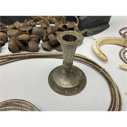 Collection of traditional necklaces from the Solomon Islands, including shell and boar tusk examples, together with a carved canoe prow, with mother of pearl eyes, painted cow hide and a copper plaque, depicting the Solomon Islands, with presentation engraving