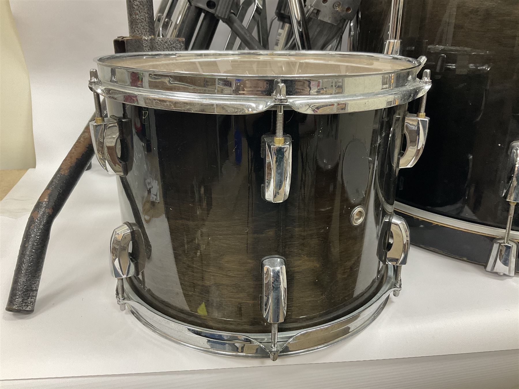 Pearl Vision SST Birch Ply shell four-piece drum kit in black comprising bass drum with foot pedal and three graduated toms; together with Pearl Custom Alloy Sensitone steel snare drum, drum and cymbal stands, microphone stand, stool and various drum sticks 