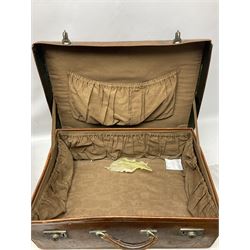 Early 20th century leather suitcase marked to the top 'Major P.M. Newton R.E. Crossways, Bridlington, East Yorkshire' 60 x 40cm; another similar leather suitcase marked W.D. to the lid; three post-WW2 respirators; and three unopened pairs of British Army N.B.C. (Nuclear Biological Chemical) No.1 Mk.III Trousers Protective (8)