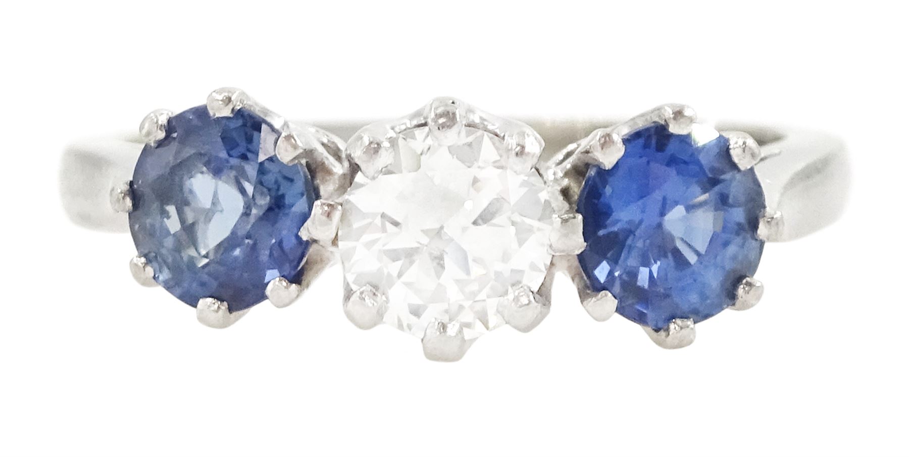 Platinum three stone round cut diamond and cornflower blue sapphire ring, Birmingham 1995, diamond approx 0.50 carat, total sapphire weight approx 1.15 carat