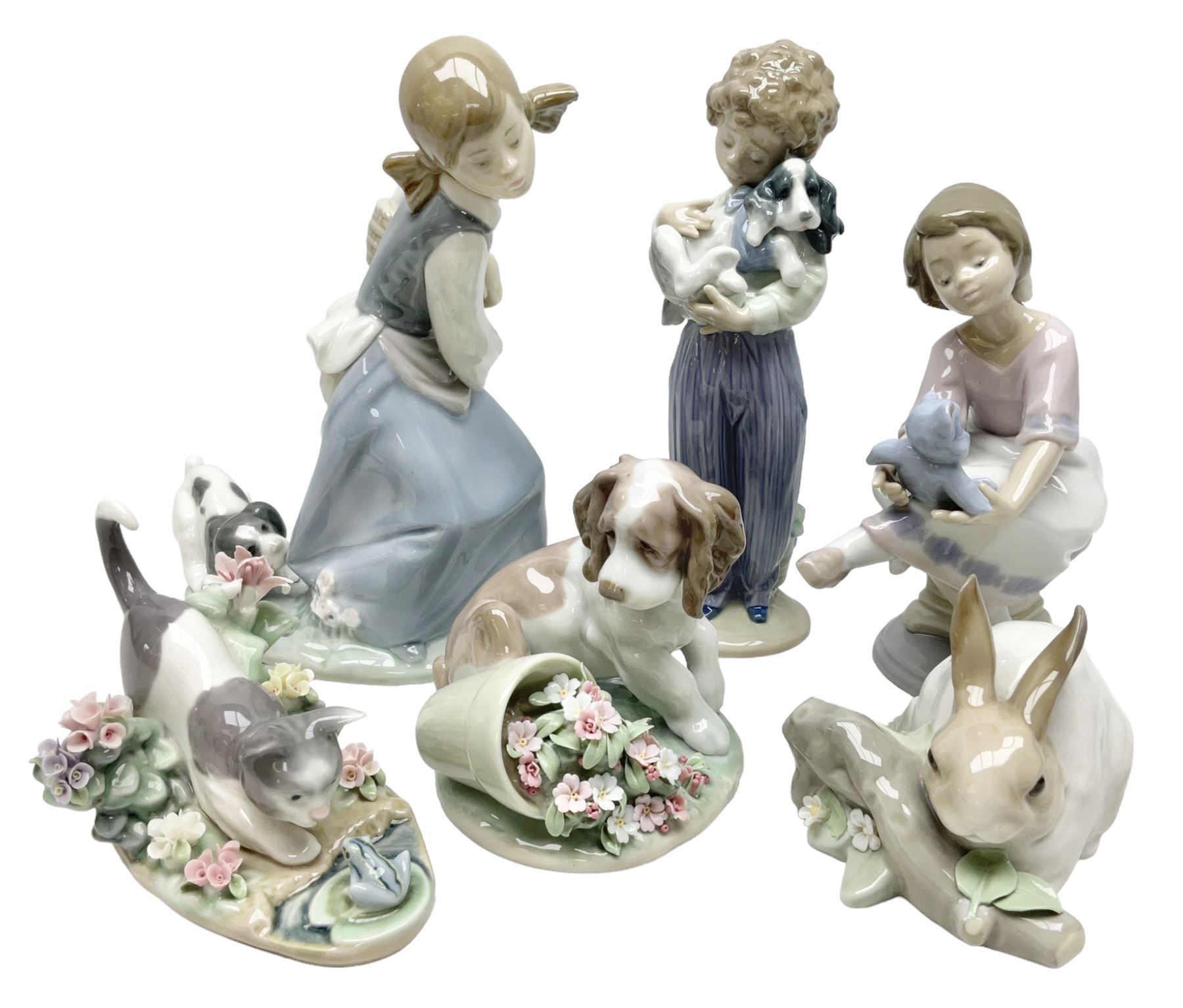 Six Lladro figures, comprising Naughty Dog no 4982, Best Friend 7620 and My Buddy no 7609, Kitty Confrontation no 1442, It Wasn't Me no 7672 and Rabbit Eating no 4772, three with original boxes, largest example H22cm