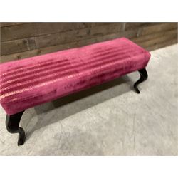 Large rectangular footstool upholstered in a maroon fabric with cabriole supports