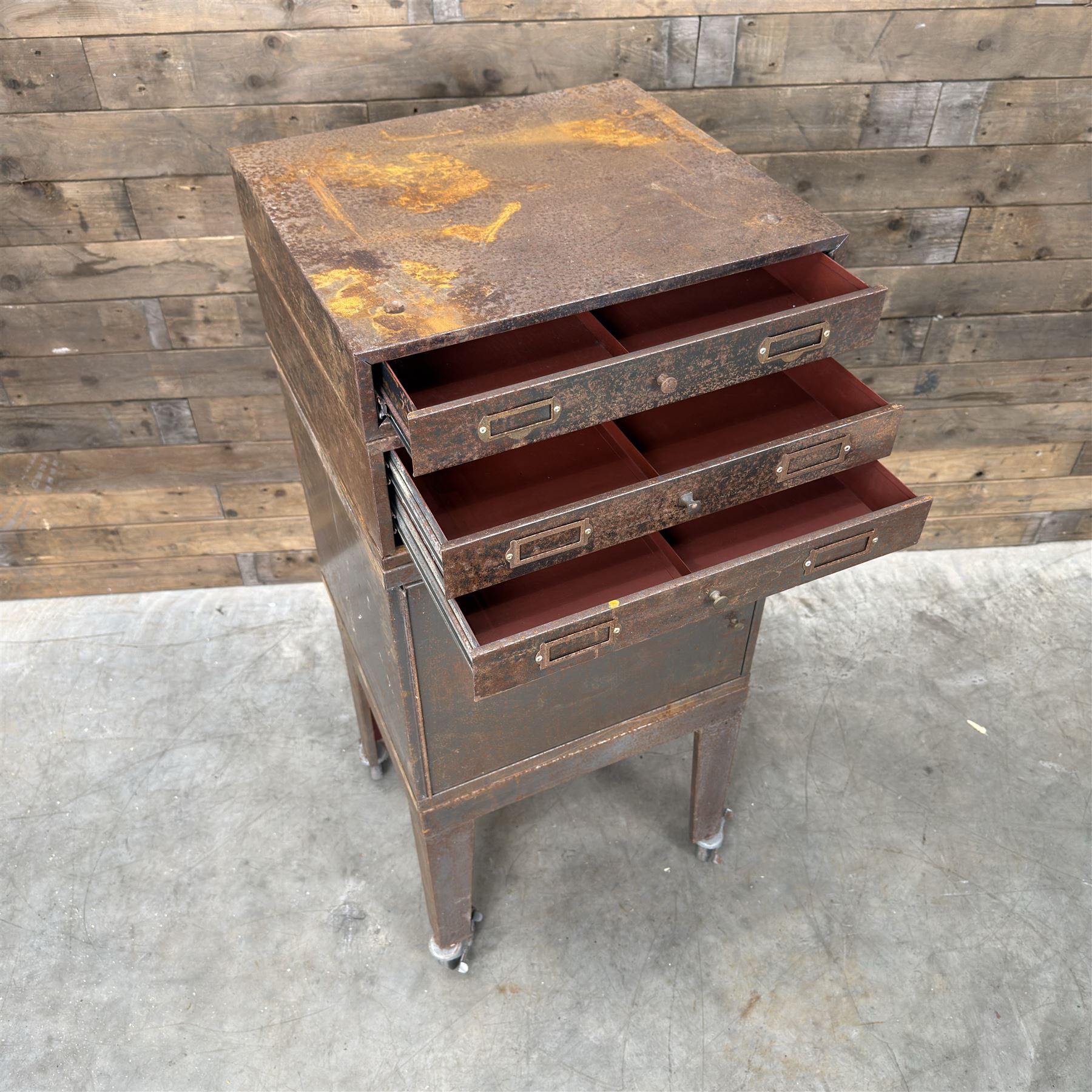 Luxor - industrial modular cabinet, three sections comprising single drawer, double drawer and single cupboard, raised on stand; and a tall industrial cabinet