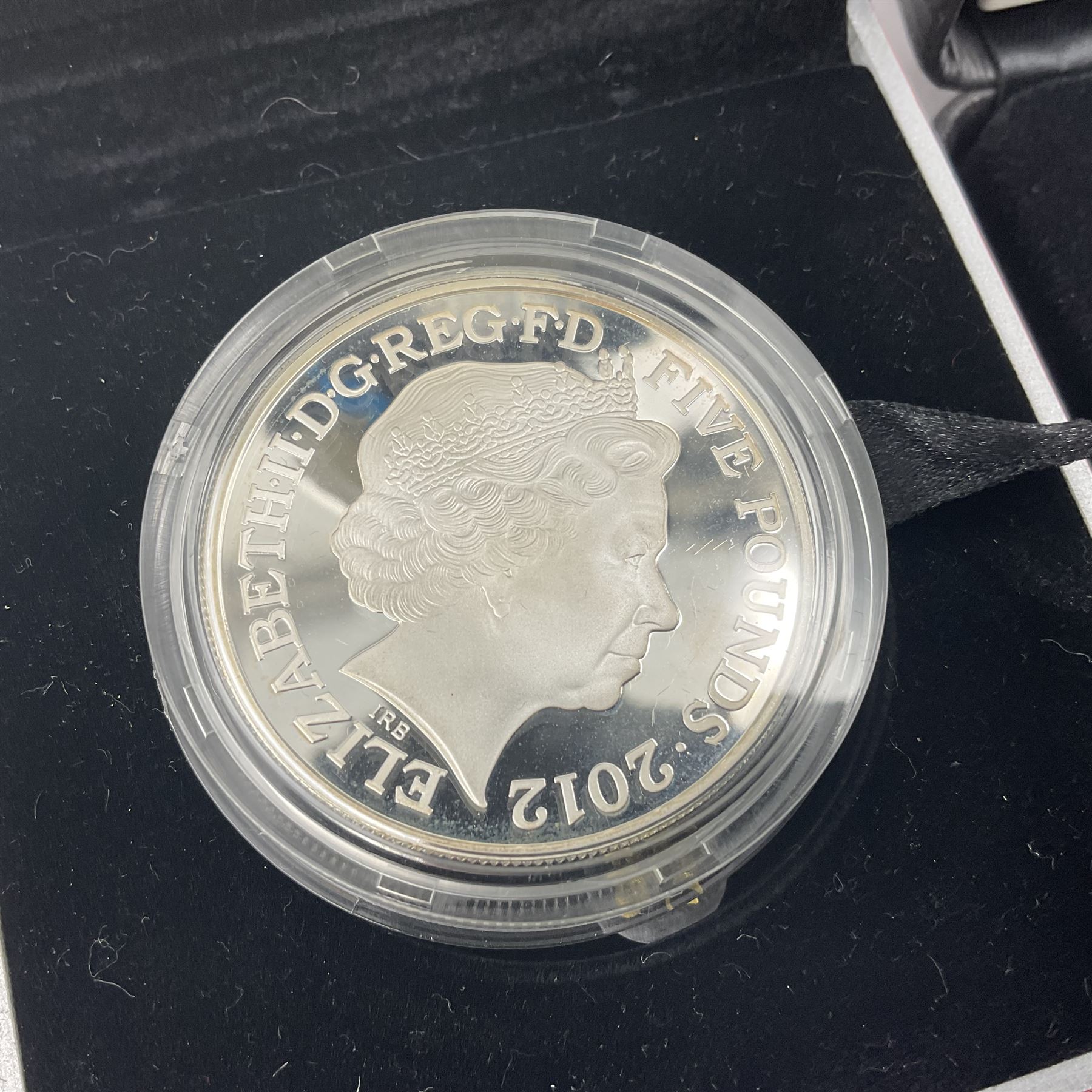 Three The Royal Mint United Kingdom silver proof five pound coins, comprising 2012 'London 2012 Paralympic', 2015 '100th Anniversary of the Death of Edith Cavell' and 2017 'Remembrance Day' piedfort, all cased with certificates 