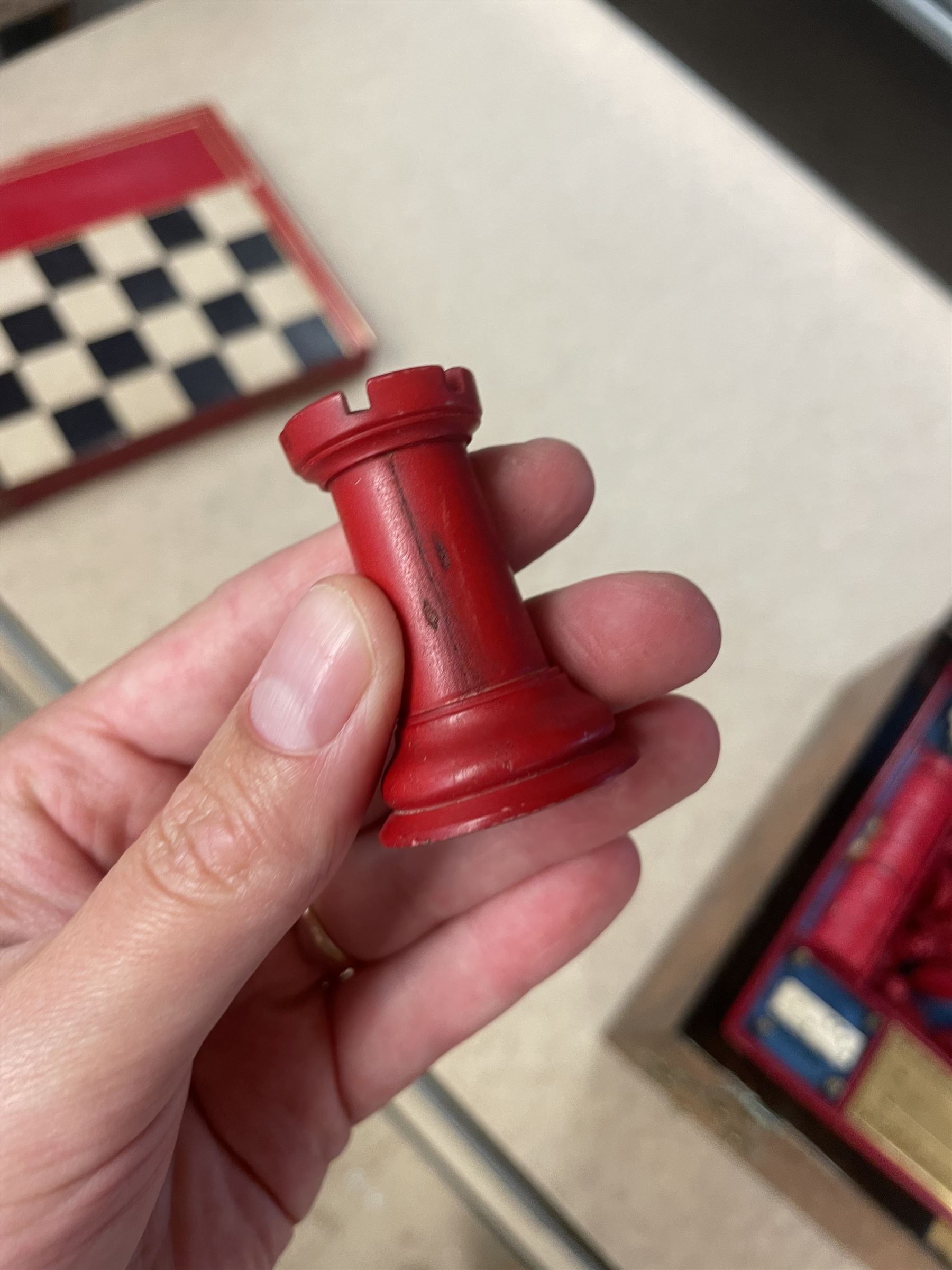 19th century walnut and brass bound games compendium box, painted to enhance the grain, of rectangular form, the hinged opening cover with rounded sides, central brass cartouche with engraved lion crest, and brass riveted straps, opening to reveal a red leather and blue silk lined compartmented interior, with fold-down games board, and lift-out tray containing playing cards, ebony turned dice towers, white and red stained bone draughts, and chess pieces, ivory dice, and ivory and ebony whist markers, and brass bezique board, cribbage board and markers, H15cm W32cm D24cm
This lot has been registered for sale under Section 10 of the APHA Ivory Act