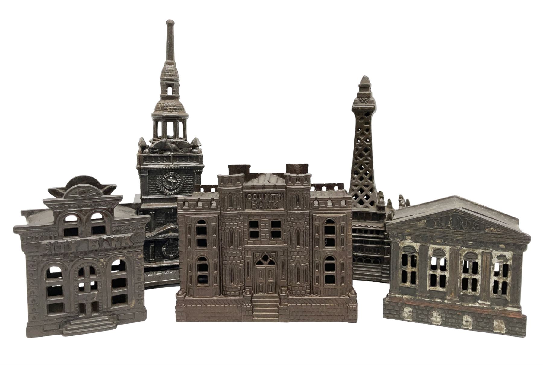 Five early 20th century cast-iron money banks as buildings - 'City Bank' c1904 H10cm; 'County Bank' c1905 H11cm; 'Town Hall Bank' c1900 H8.5cm; 'Tower Bank' c1902 H23.5cm; all made by John Harper; and 'Blackpool Tower Bank' c1907 by Chamberlain & Hill H18.5cm (5)