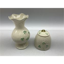 Two Royal Copenhagen figures modelled as seated pigs, Belleek figure of a pig with green mark beneath, and Belleek three leaf clover pattern vase and honey pot, all marked beneath (5)