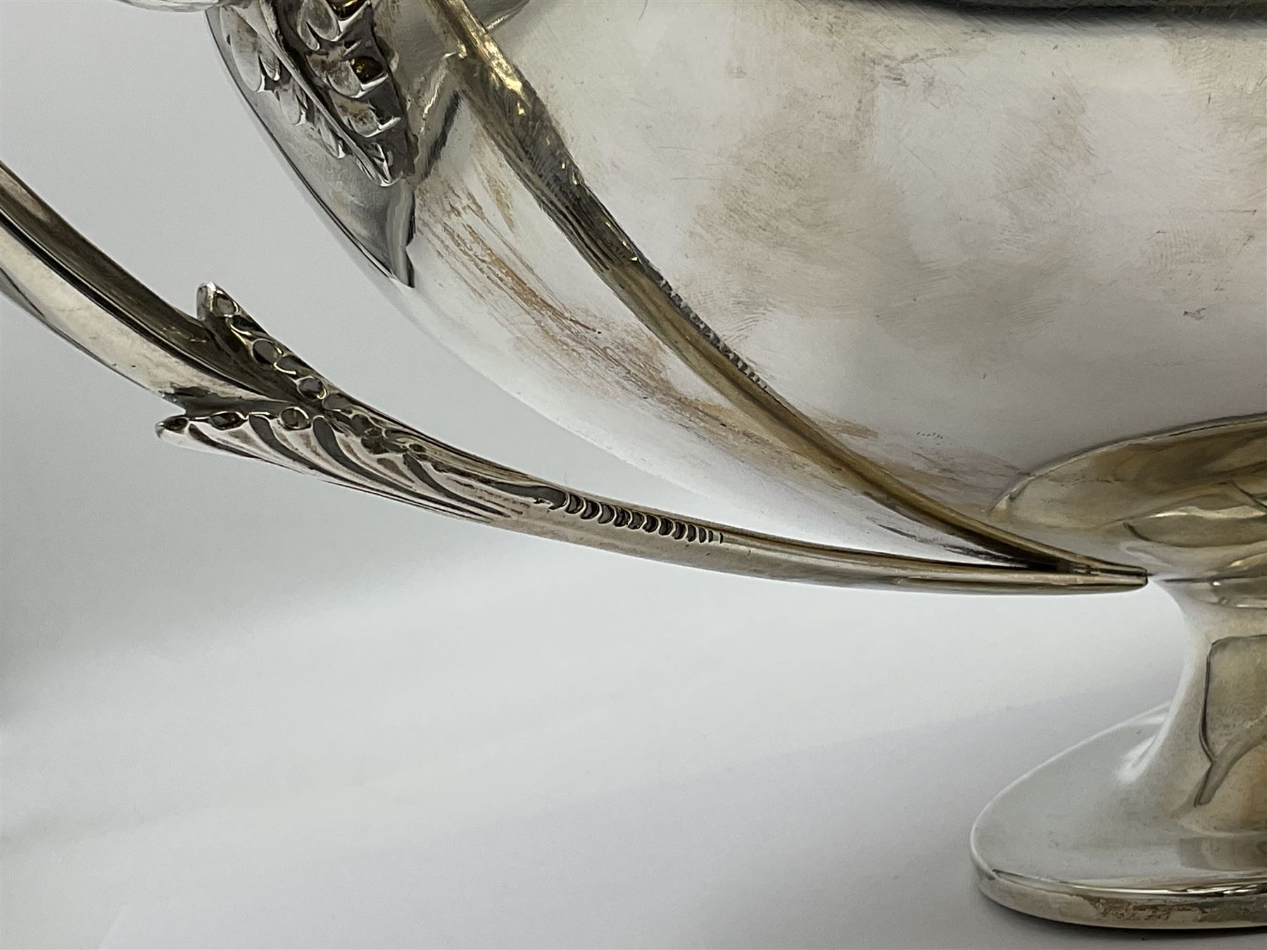 1920s silver twin-handled pedestal bowl, of navette form with twin bifurcated acanthus capped scroll handles, engraved with initial R to body and upon spreading oval foot, hallmarked Hawksworth, Eyre & Co Ltd, Sheffield 1925, including handles H21.8cm