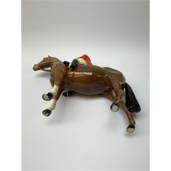 A Beswick equestrian figure modelled as a huntsman on bay horse, with printed mark beneath, together with a Beswick Norman Thelwell figure of a pony and rider, with printed mark beneath  