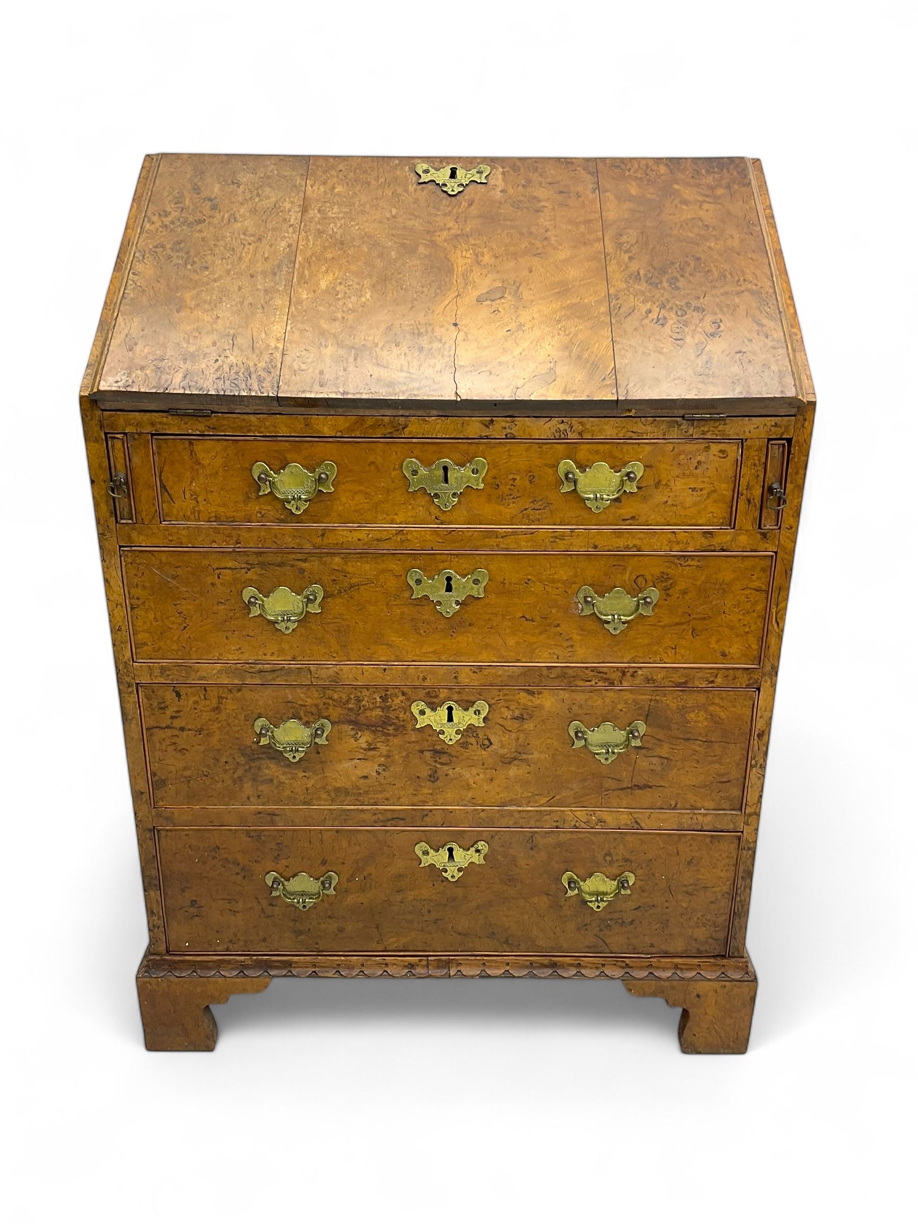 George III figured walnut bureau, fall-front enclosing central cupboard, six pigeonholes and six drawers, fitted with four graduated cockbeaded drawers, on bracket feet