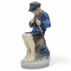 Four Royal Copenhagen figures, including Amager Girl Sewing no. 1314, Boy Whittling no. 905, Girl with Goose no. 528, and Amager Girls Reading no. 1395
