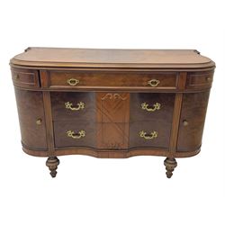 Late 20th century Italian walnut sideboard, serpentine front and bow-shaped top with highly figured veneer, single checkered-pattern frieze drawer over two drawers with central foliage cartouche, flanked by hinged frieze drawers over cupboards, on turned and carved supports