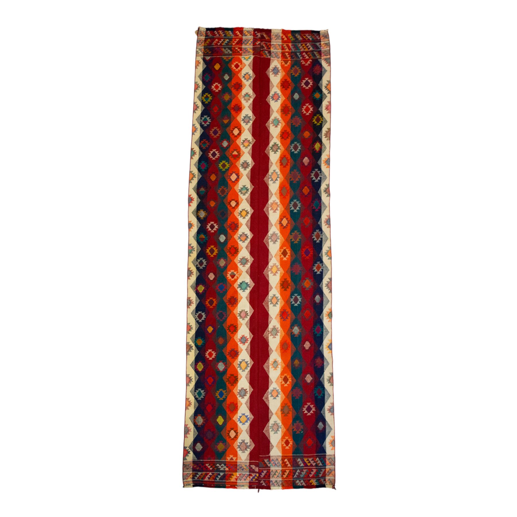 Southwestern Persian Jajim kilim, flat woven in bold bands of crimson, orange, cream, and indigo, decorated with rows of hooked diamond and star motifs 