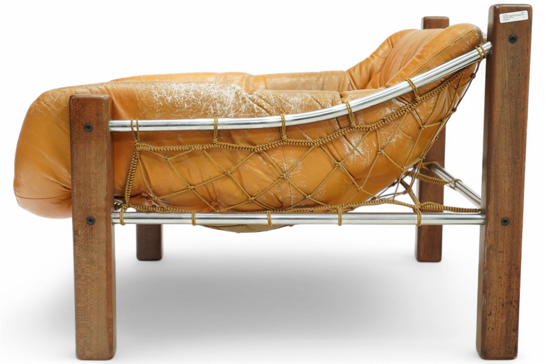 Jean Gillon (Romanian/Brazilian 1919-2007): 'Amazonas' easy chair, mahogany framed with slung leather upholstered cushions, together with matching footstool
