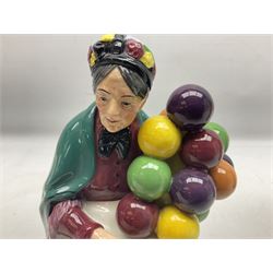 Three Royal Doulton figures, comprising Balloon Lady HN293, The Old Balloon Seller HN1315 and Biddy Penny Farthing HN1843, all with printed marks beneath