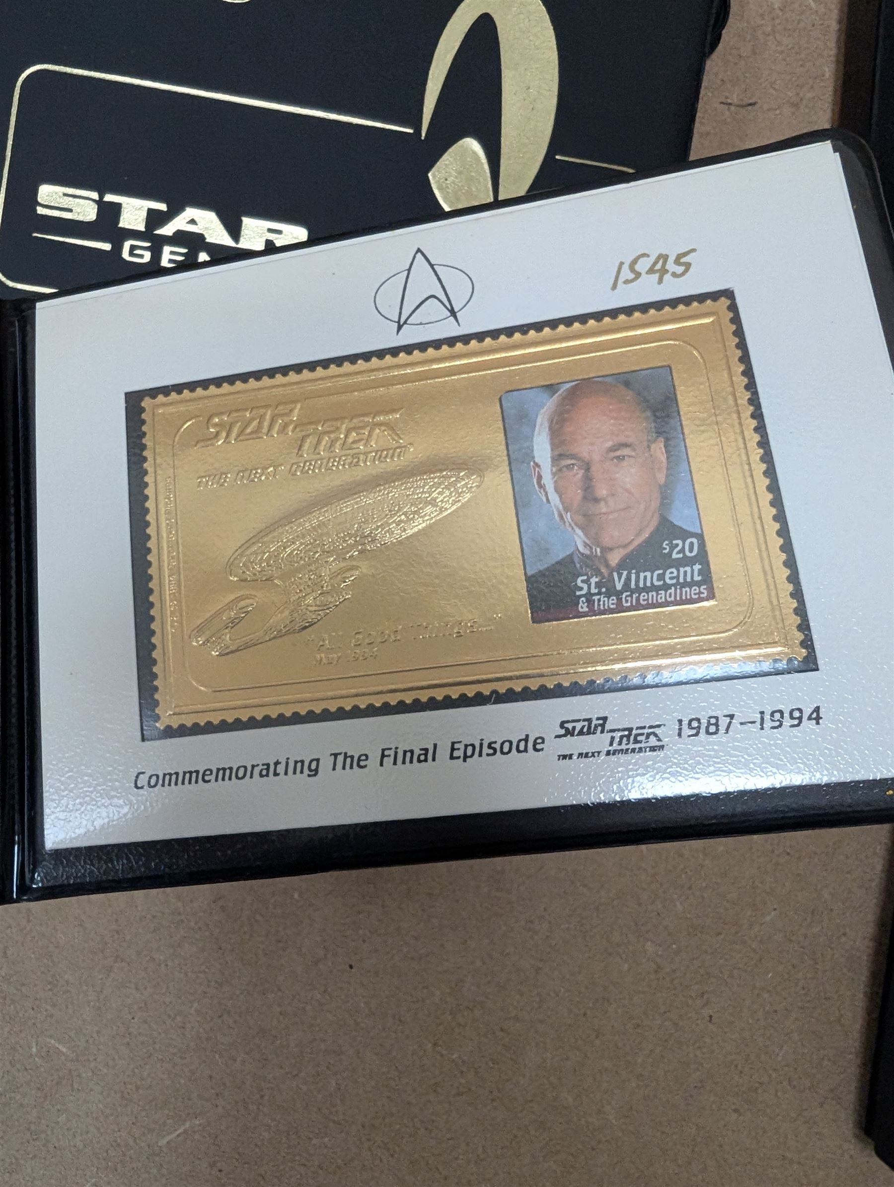 Star Trek collectables, including Danbury Mint '22ct Gold Card Collection', PCS Stamps and Coins Official US Postage Celebrating The Original Star Trek Series, Star Trek St Vincent and Grenadines first day cover collection, four stamp sets and a framed set of similar stamps, commemorative coins, Star Trek The Experience Las Vegas coin, three commemorative 'gold stamps' and three albums of collectors cards and telephone cards