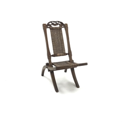  19th century oak folding campaign chair, carved and pierced cresting rail, canework back and seat, W39cm  