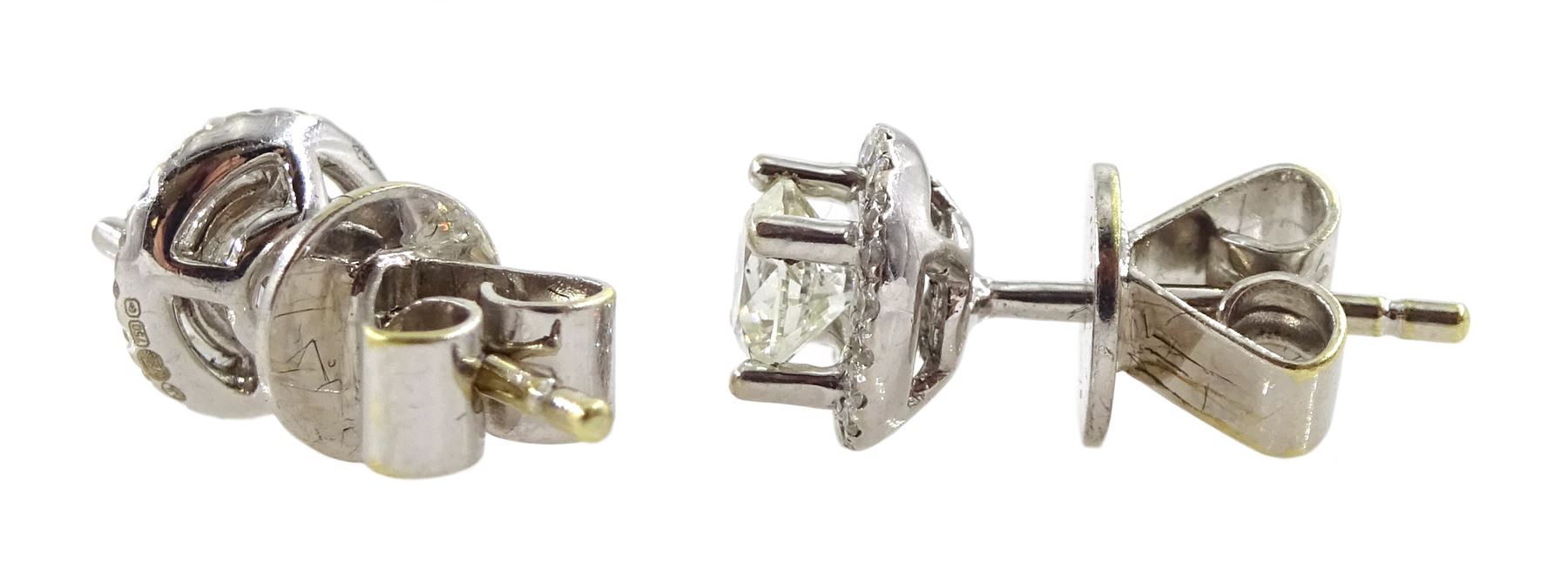 Pair of 18ct white gold round brilliant cut diamond halo stud earrings, total diamond weight approx 0.40 carat