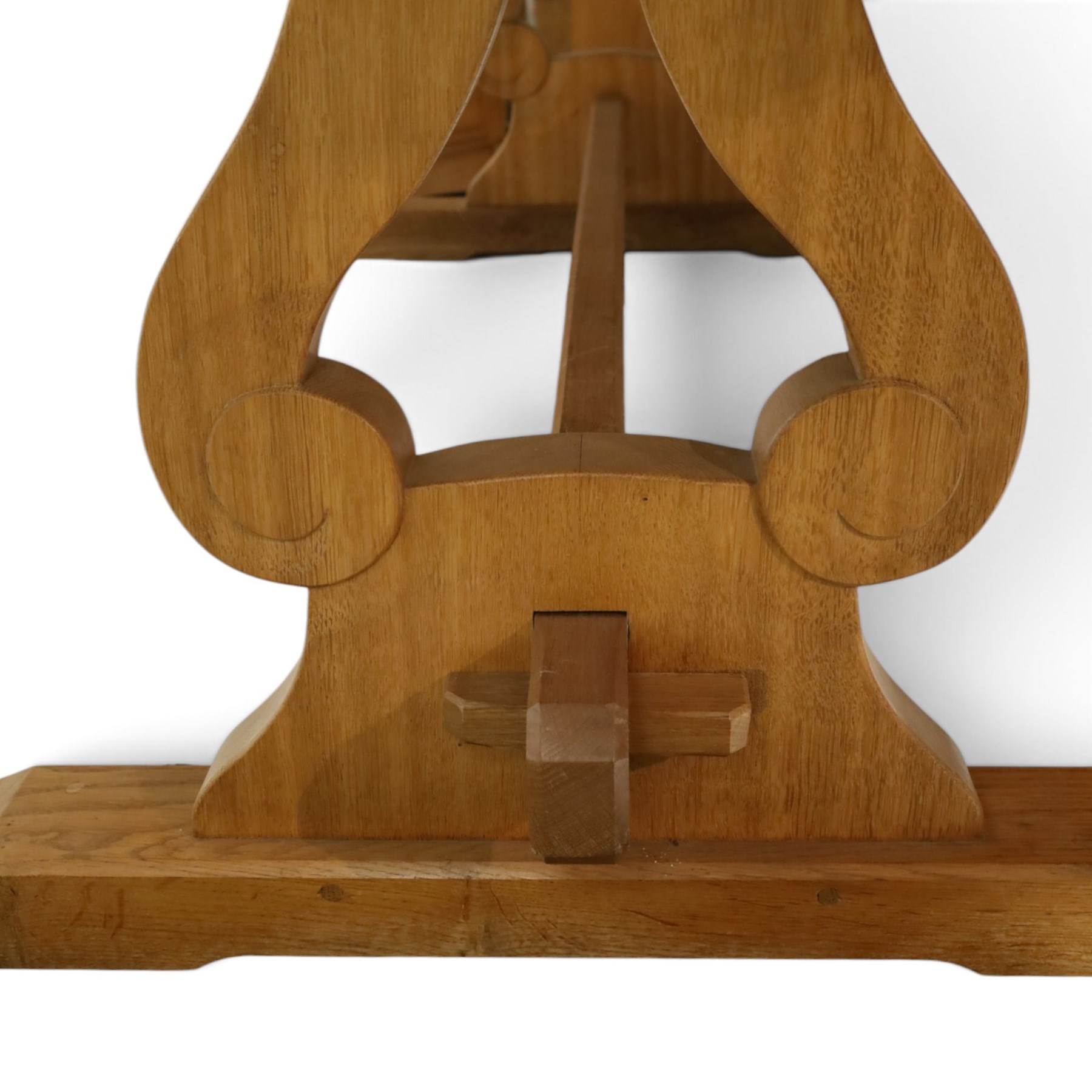 Acorn Industries - oak dining table, rectangular top with rounded corners and chamfered edge, raised on twin lyre-shaped supports united by pegged stretched on sledge feet, carved with acorn signature to stretcher, by Alan Grainger, Brandsby