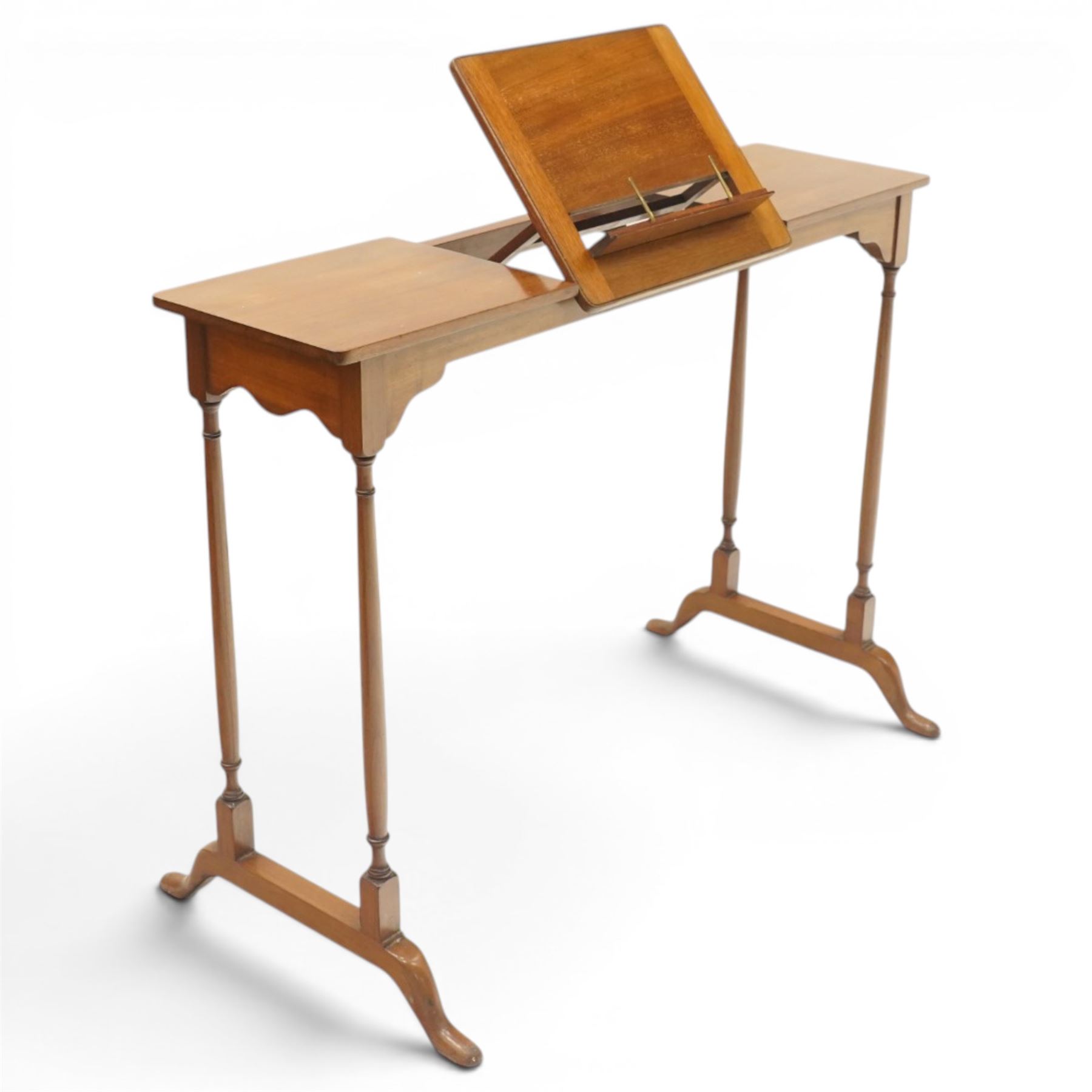 Edwardian mahogany reading stand, rectangular adjustable book rest with hinged ledge, flanked by rectangular side shelves, on slender turned twin end supports with splayed feet