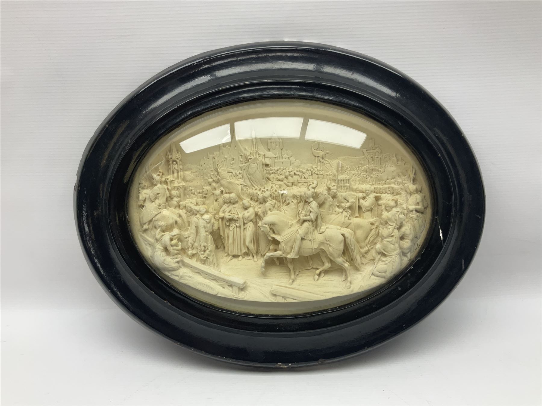 Justin Mathieu; oval high relief plaque depicting a battle scene, within frame H36cm