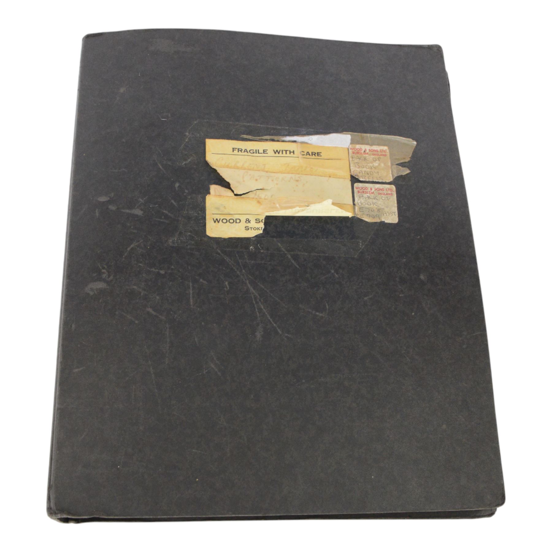 Wood & Sons Ltd Burslem pattern book, late 20th century, designs in colour and black and white, all mounted onto square leaves, leaves annotated with decorating notes, some cancellations noted boldly over the design, collected as one in a ring binder, factory labels to upper-cover, folio 44.5 x 36cm