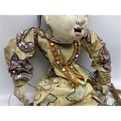 Large string puppet, probably Thai or Burmese, modelled as a woman in traditional costume embellished with sequins, the painted head with articulated mouth, the wood body and hands jointed, L70cm