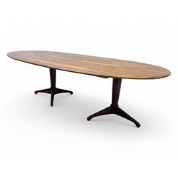 Andrew Milne for Heals - mid-20th century extending dining or boardroom table, oval top with one additional leaf, raised on twin tapering pedestal supports terminating in tripod feet