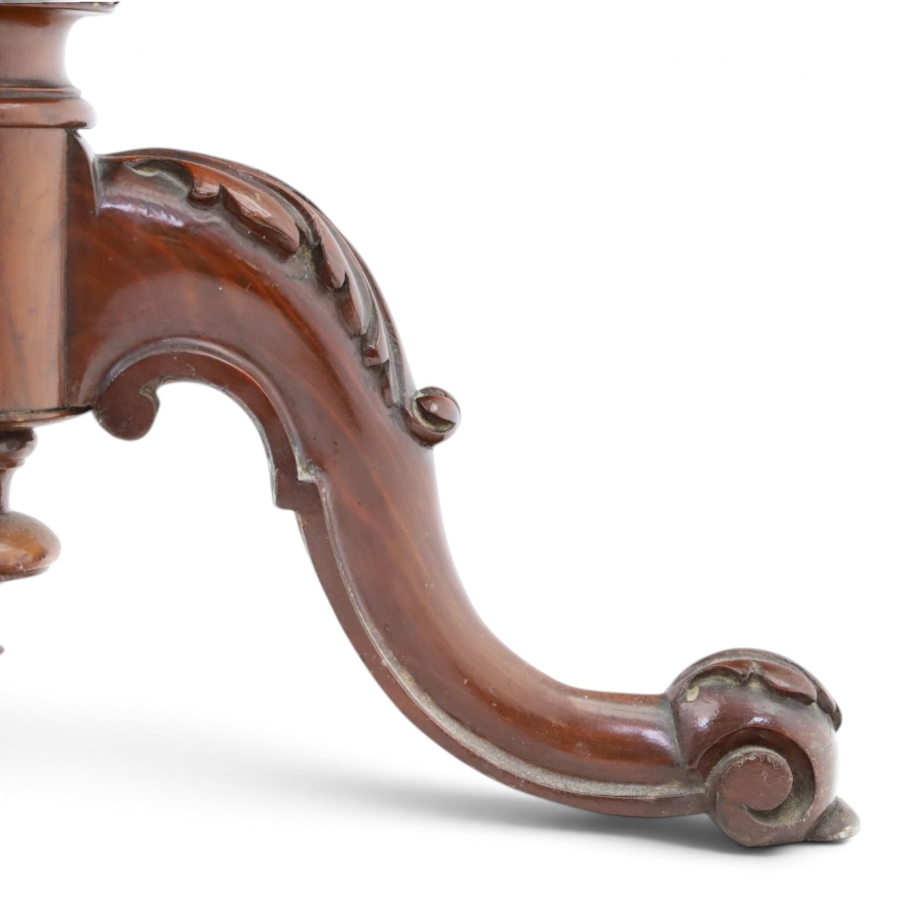 Two Victorian mahogany pole screens, comprising an oval example with floral needlework panel and carved cresting, on brass pole and tripod base with scroll carved supports (H 153cm, W 43cm, D 43cm); and a rectangular example with glazed architectural print panel, on brass pole, turned column and conforming scroll carved tripod base (H 147cm, W 38cm, D 38cm)