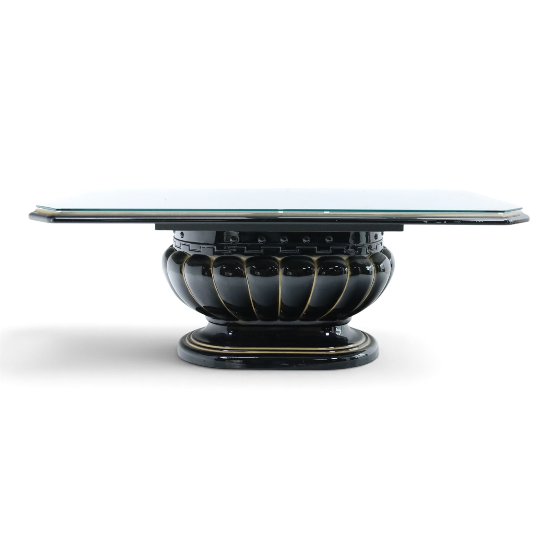 Italian Neoclassical inspired ebonised gloss coffee table, glazed cantered top with Greek key banding, on a shaped pedestal base with gilt highlights and stepped plinth 