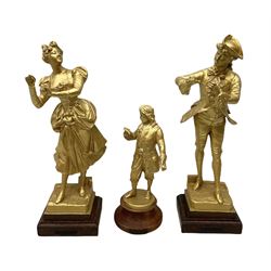 After J. Lavergne, pair of gilt painted spelter figures of a Dandy and his lady, each titled 'Propos Galant' on wooden base H41cm; and another gilt painted spelter figure, possibly Samuel Pepys (3)